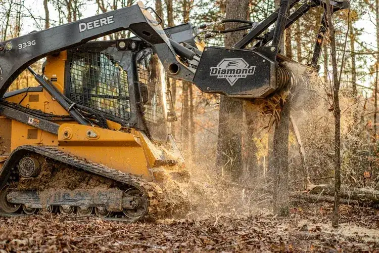 Forestry mulcher clearing brush